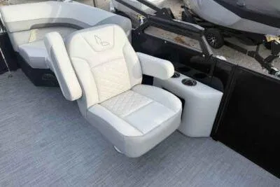 Slide: The Image of Luxurious seating on 2026 Lowe SS 230 WV boat with plush upholstery and armrests. - 8