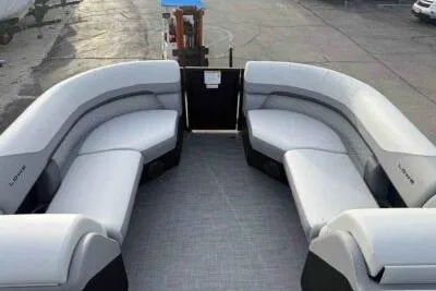 Slide: The Image of 2026 Lowe SS 230 WV pontoon boat with spacious seating and modern design. - 9