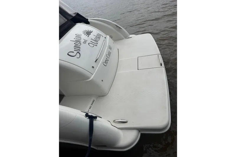 Slide: The Image of 2007 Formula 400 Super Sport boat with "Sunshine and Whiskey" text on the deck. - 13