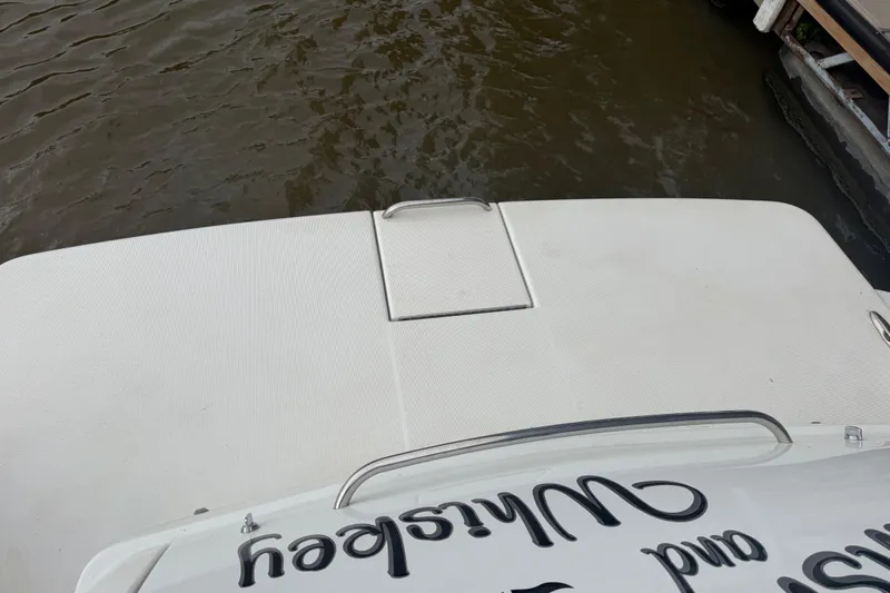 Slide: The Image of 2007 Formula 400 Super Sport boat stern near dock, with visible water surface. - 14