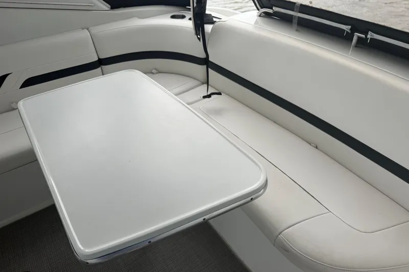 Slide: The Image of Interior of 2007 Formula 400 Super Sport boat with white seating and table. - 17