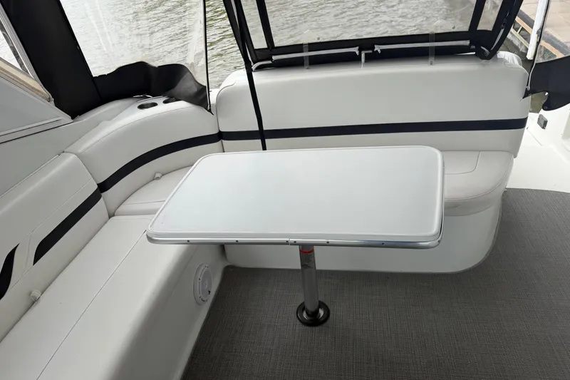 Slide: The Image of 2007 Formula 400 Super Sport boat interior with white seating and table. - 18
