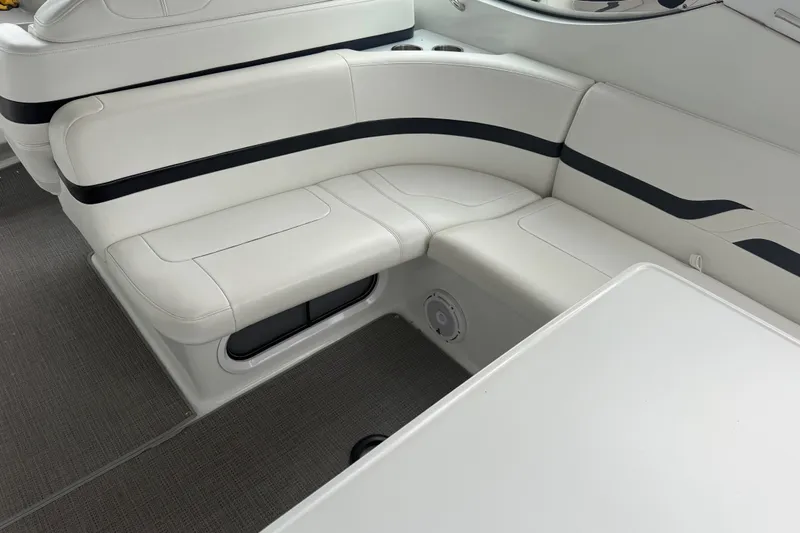 Slide: The Image of Luxurious white seating in a 2007 Formula 400 Super Sport boat interior. - 19