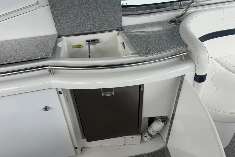 Slide: The Image of 2007 Formula 400 Super Sport yacht kitchenette with sink, countertop, and mini fridge. - 20