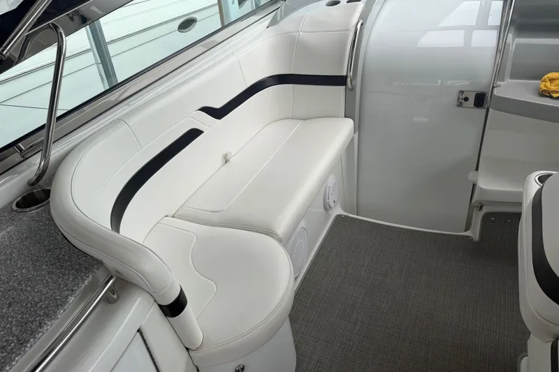 Slide: The Image of Interior of a 2007 Formula 400 Super Sport boat with white seating and modern design. - 22