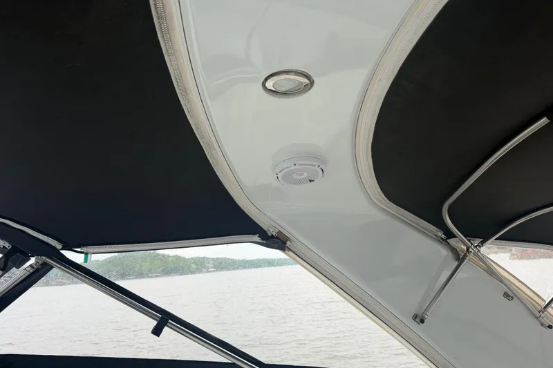 Slide: The Image of Interior view of a 2007 Formula 400 Super Sport boat canopy with speaker and light. - 25