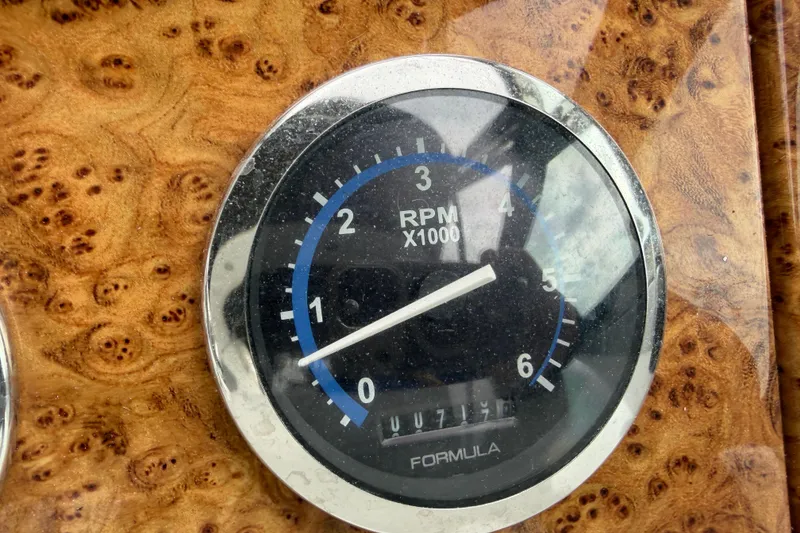 Slide: The Image of Tachometer of 2007 Formula 400 Super Sport boat, displaying RPM on wood grain dashboard. - 28