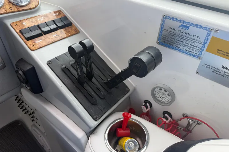 Slide: The Image of Control panel of a 2007 Formula 400 Super Sport yacht with throttle levers and certification. - 32