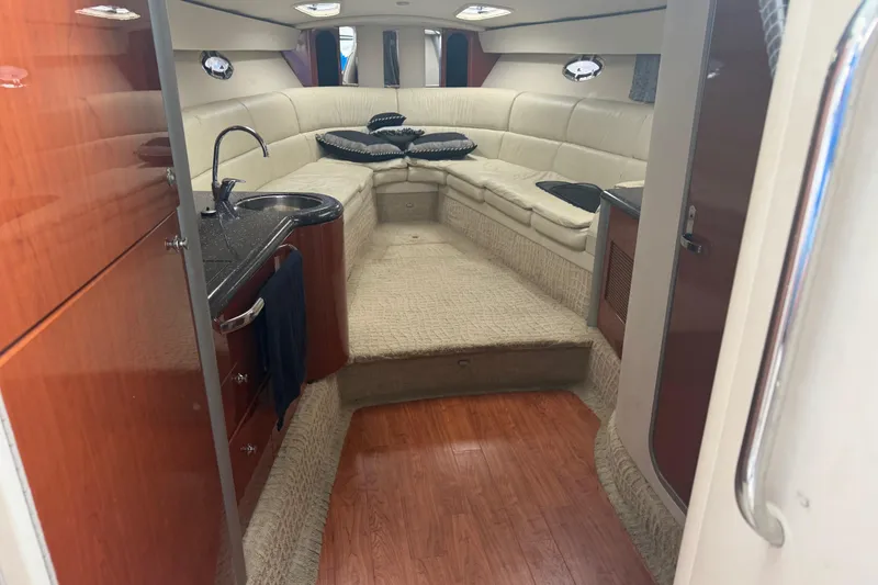 Slide: The Image of Interior of a 2007 Formula 400 Super Sport yacht with plush seating and kitchenette. - 33