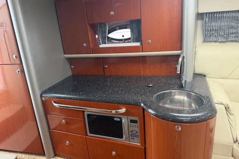 Slide: The Image of Luxurious 2007 Formula 400 Super Sport yacht interior with sleek kitchenette and modern amenities. - 35