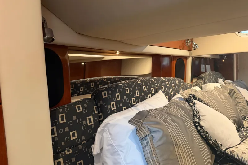 Slide: The Image of Luxurious cabin interior of a 2007 Formula 400 Super Sport yacht with plush bedding. - 41