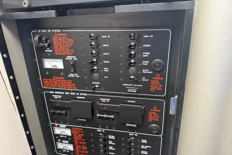 Slide: The Image of Control panel of a 2007 Formula 400 Super Sport boat, featuring various switches and warnings. - 43