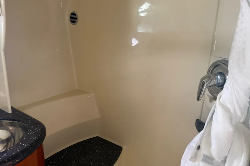 Slide: The Image of Interior of 2007 Formula 400 Super Sport boat bathroom with sink and shower controls. - 45