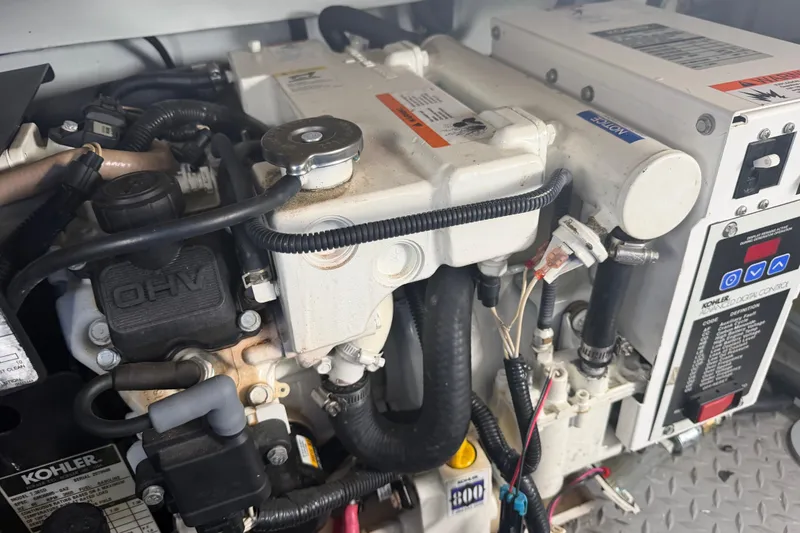 Slide: The Image of Engine compartment of a 2007 Formula 400 Super Sport boat, featuring Kohler components. - 47