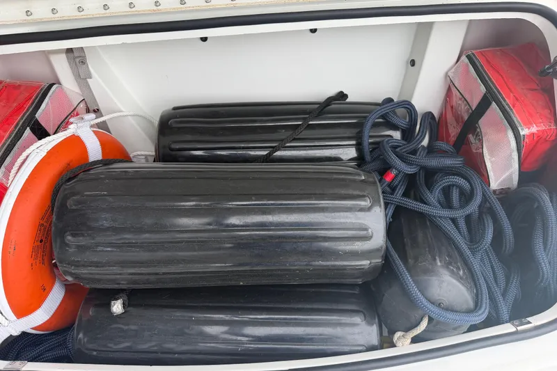 Slide: The Image of Storage compartment of a 2007 Formula 400 Super Sport with boat fenders and safety equipment. - 51