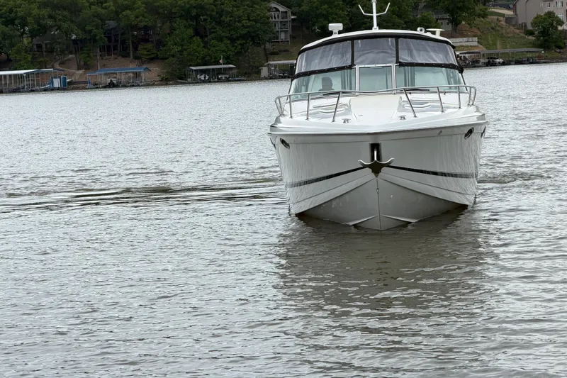 Slide: The Image of 2007 Formula 400 Super Sport boat cruising on a serene lake. - 7