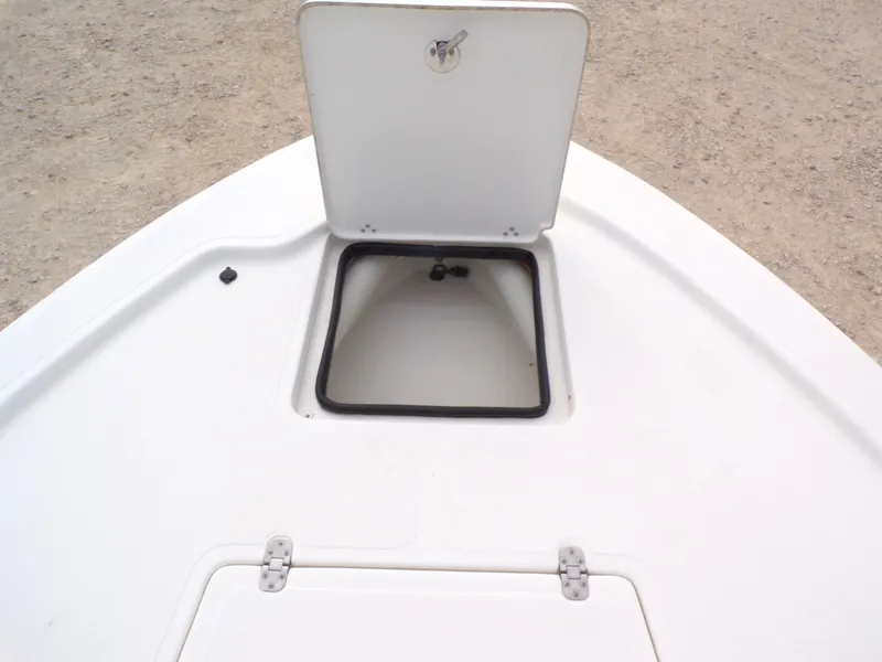 Slide: The Image of Open storage hatch on a 2022 Mako 18 LTS boat. - 27