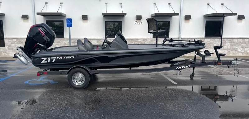 The Image of 2022 Nitro Z17 boat on trailer in a parking lot. - 1