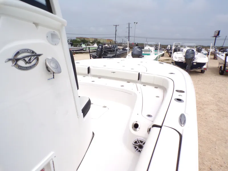 Slide: The Image of 2026 Tidewater 2500 Carolina Bay boat in a parking lot. - 26