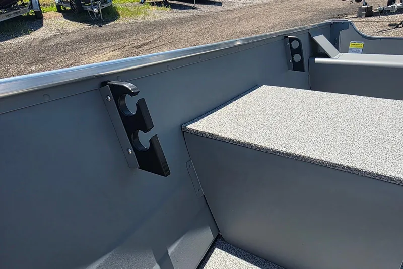 Slide: The Image of 2026 Smoker Craft Alaskan 15 TS DLX boat interior with rod holder and storage. - 8