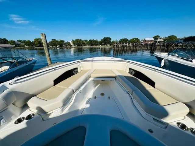 Slide: The Image of 2023 Boston Whaler 360 Outrage boat with spacious seating at the dock. - 34