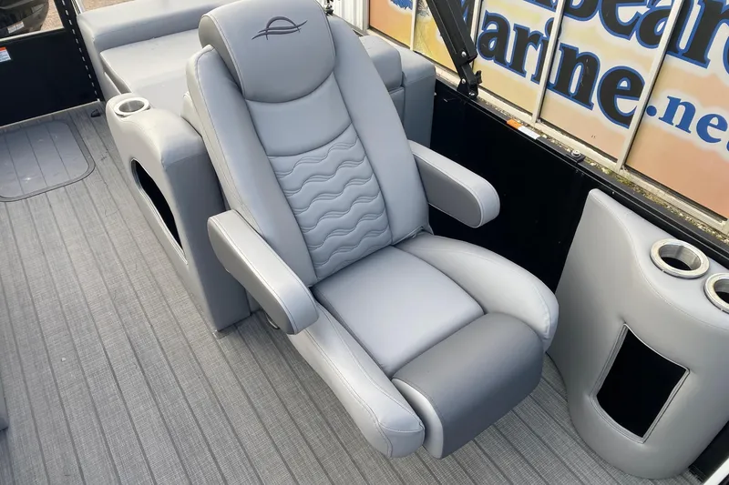 Slide: The Image of Luxurious seating on 2026 SunCatcher Fusion 322SS boat, featuring plush gray upholstery and cup holders. - 9