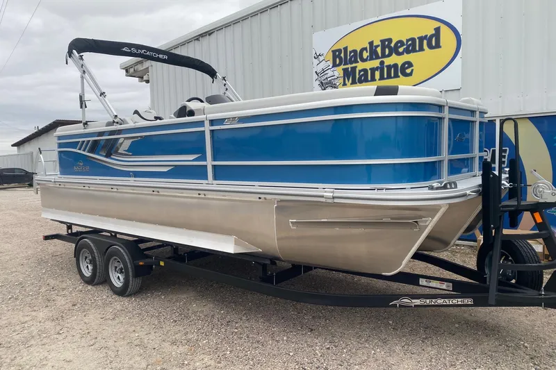 Slide: The Image of 2026 SunCatcher Select 322RC pontoon boat on trailer at BlackBeard Marine dealership. - 3