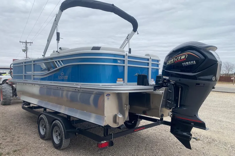 Slide: The Image of 2026 SunCatcher Select 322RC pontoon boat with Yamaha outboard motor on trailer. - 5