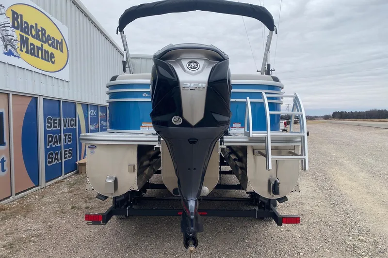 Slide: The Image of 2026 SunCatcher Select 322RC boat with powerful outboard motor at BlackBeard Marine dealership. - 6