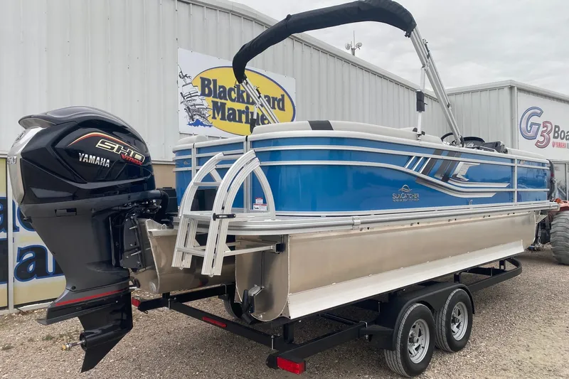 Slide: The Image of 2026 SunCatcher Select 322RC pontoon boat with Yamaha engine, displayed at Blackbeard Marine. - 7