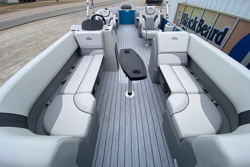 Slide: The Image of 2026 SunCatcher Select 322RC pontoon boat interior with plush seating and modern design. - 8