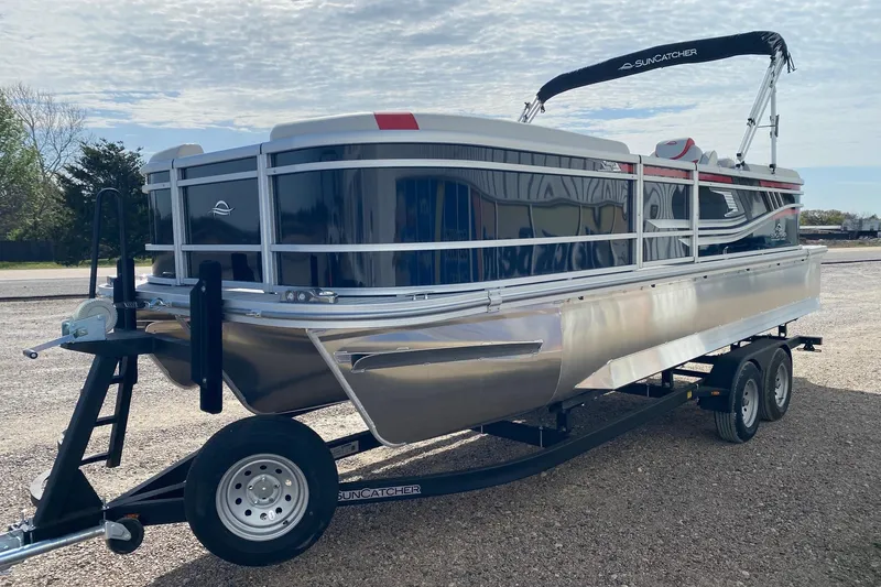 Slide: The Image of 2026 SunCatcher Select 322RC pontoon boat on trailer, parked outdoors. - 3