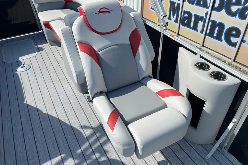 Slide: The Image of Luxurious seating on 2026 SunCatcher Select 322RC pontoon boat with cup holders and stylish design. - 9
