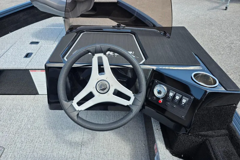 Slide: The Image of 2026 Smoker Craft Pro Angler 165 SC dashboard with steering wheel and control panel. - 17