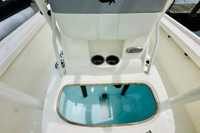 Slide: The Image of 2023 Mako 18 LTS boat interior with livewell and seating area. - 17