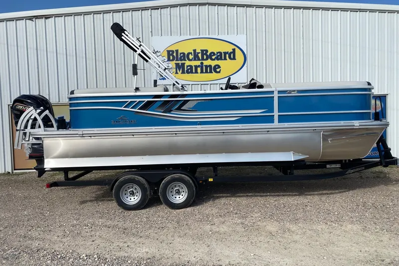 The Image of 2026 SunCatcher Select 322RC pontoon boat on trailer at BlackBeard Marine dealership. - 1
