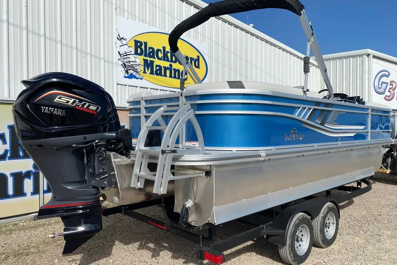 Slide: The Image of 2026 SunCatcher Select 322RC pontoon boat with Yamaha engine at Blackbeard Marine dealership. - 5