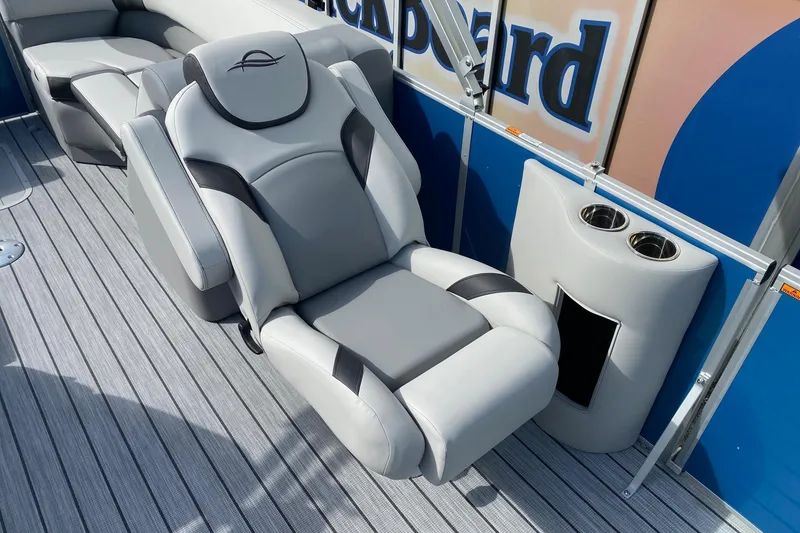 Slide: The Image of Luxurious seating on 2026 SunCatcher Select 322RC boat with cup holders. - 9