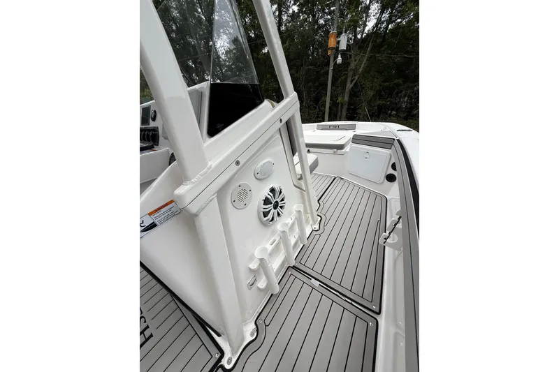 Slide: The Image of 2020 Yamaha Boats 195 FSH Sport interior with sleek deck and console details. - 12