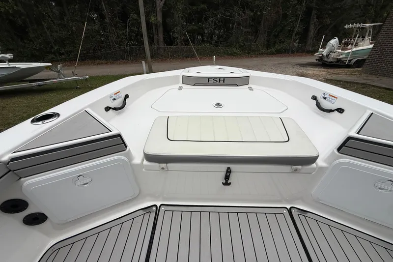 Slide: The Image of 2020 Yamaha Boats 195 FSH Sport bow area with seating and storage compartments. - 13