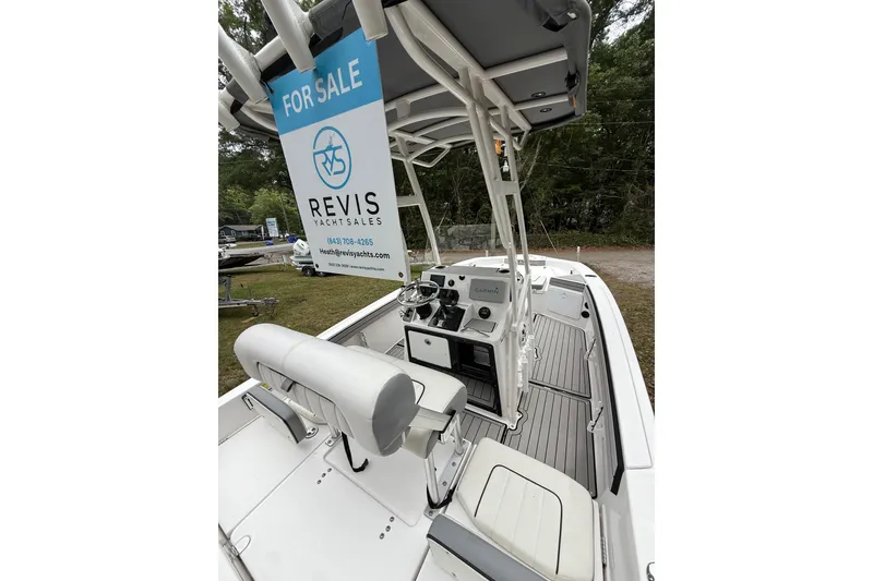 Slide: The Image of 2020 Yamaha Boats 195 FSH Sport for sale, featuring sleek interior and modern controls. - 16