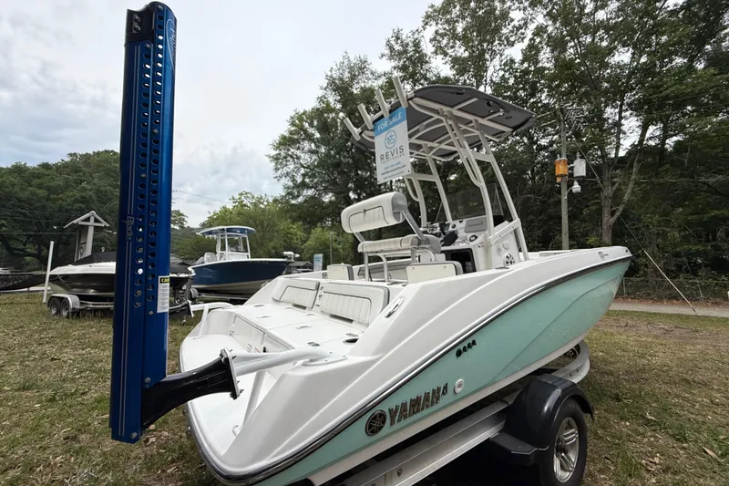 Slide: The Image of 2020 Yamaha Boats 195 FSH Sport on trailer, displayed outdoors with "For Sale" sign. - 2