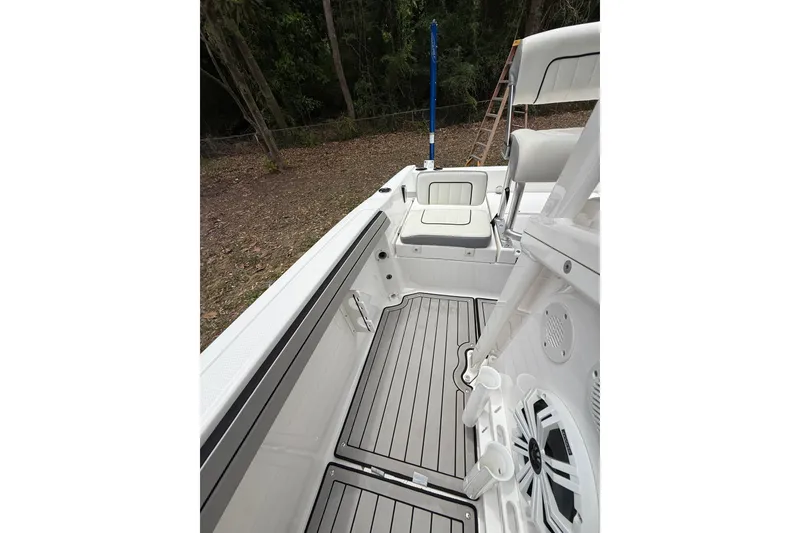 Slide: The Image of 2020 Yamaha Boats 195 FSH Sport interior with sleek seating and modern design. - 8