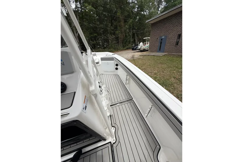 Slide: The Image of 2020 Yamaha Boats 195 FSH Sport interior with sleek deck design and modern features. - 9