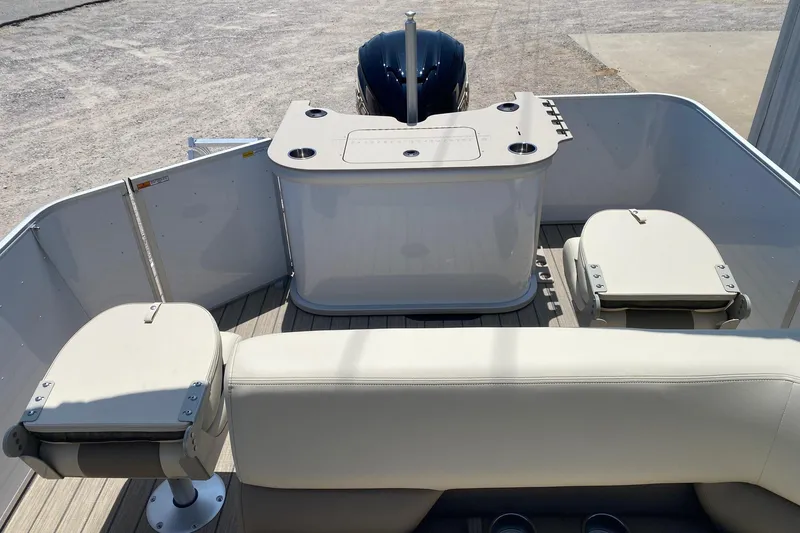 Slide: The Image of 2026 SunCatcher Select 322RF boat interior with seating and table setup. - 11