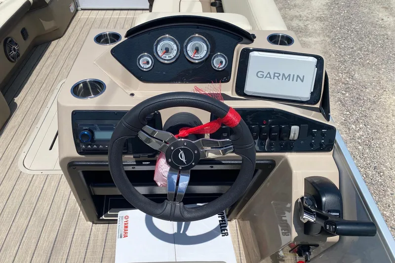 Slide: The Image of Steering console of 2026 SunCatcher Select 322RF boat with Garmin navigation system. - 13