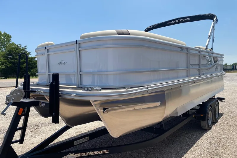 Slide: The Image of 2026 SunCatcher Select 322RF pontoon boat on trailer, sunny day, side view. - 3