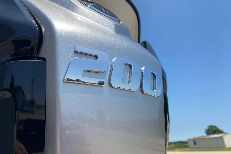 Slide: The Image of Close-up of SunCatcher Select 322RF 2026 model with '200' emblem, clear blue sky. - 5