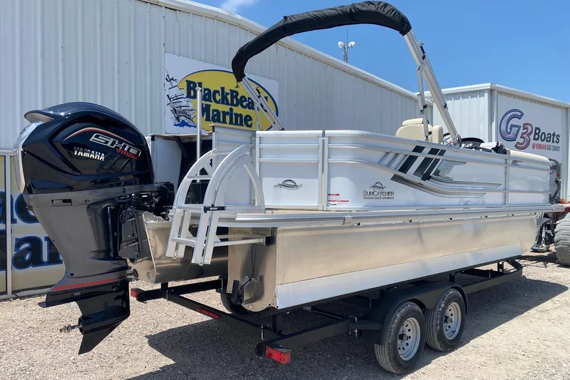 Slide: The Image of 2026 SunCatcher Select 322RF pontoon boat with Yamaha engine at Black Bear Marine dealership. - 6