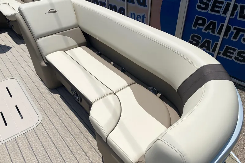 Slide: The Image of Luxurious seating on 2026 SunCatcher Select 322RF pontoon boat, featuring elegant beige upholstery. - 8